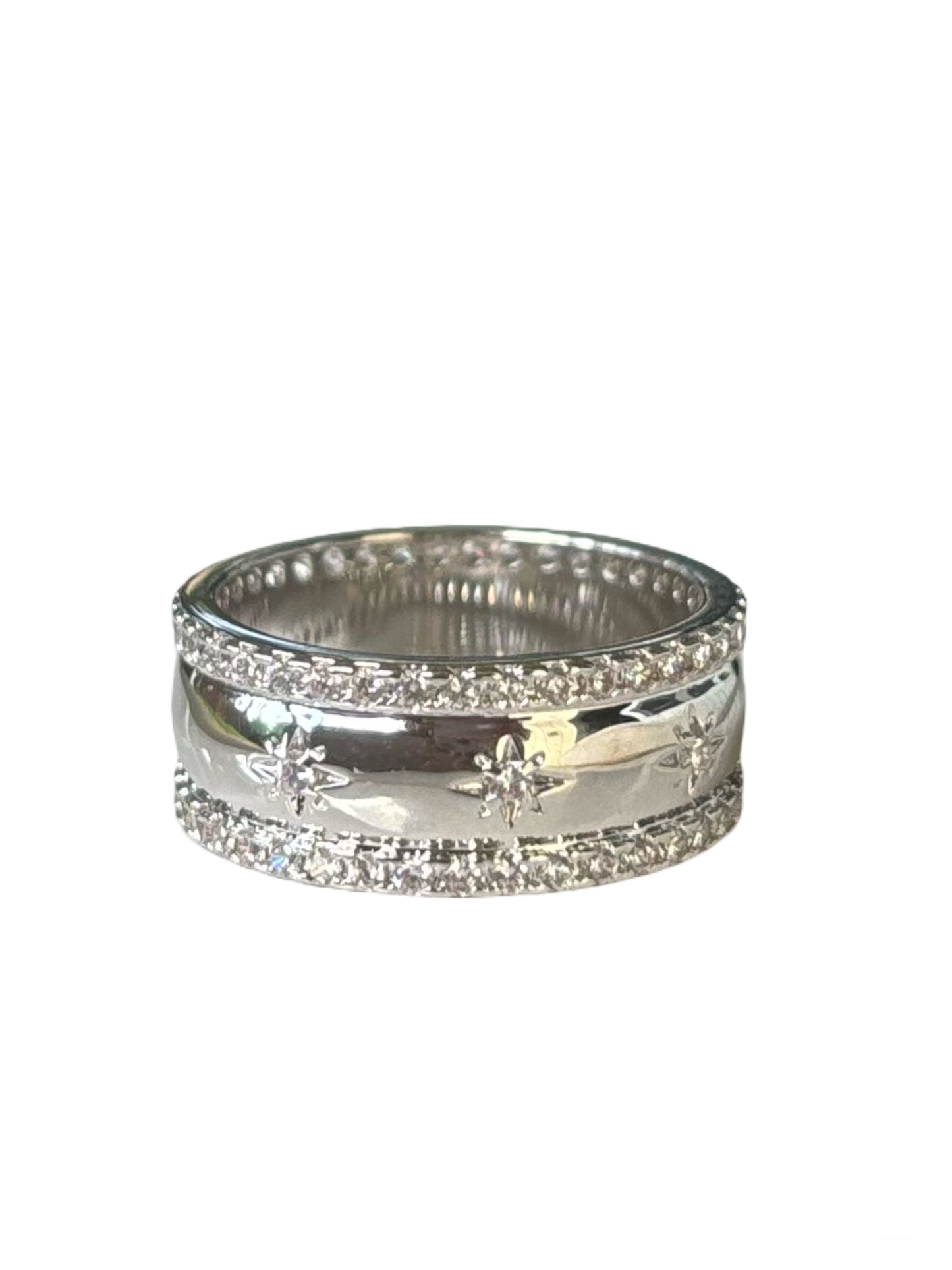 Silver ring with embedded stones on a white background
