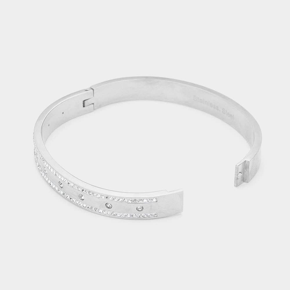 Silver bracelet with small stones on a light gray background