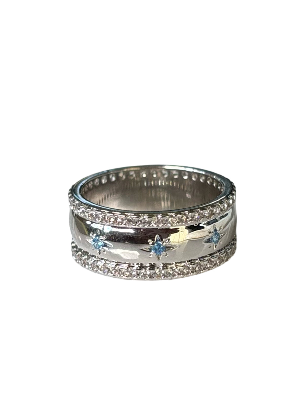 Silver ring with blue gemstones on a white background